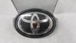 Znaczek emblemat logo pod radar grill przód TOYOTA Corolla E21 2018-