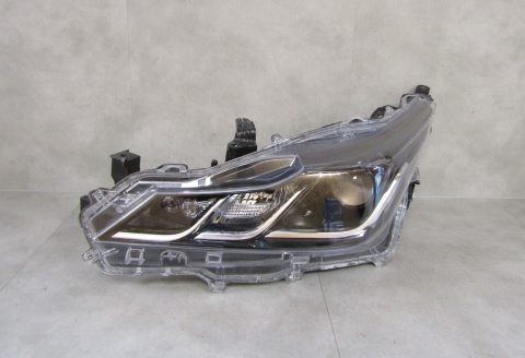 LAMPA PRZÓD TOYOTA COROLLA E21 SEDAN ZWYKŁA SOCZEWKA LH 18- 81150-02T31-00