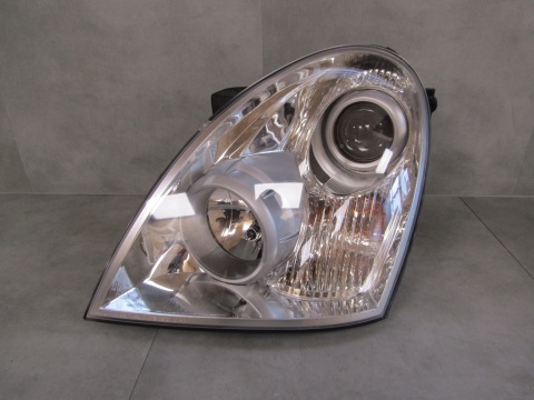 Lampa przód Ssangyong Rexton LIFT ZWYKŁA 06-12 LH